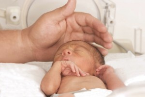 Newborn baby inside incubator